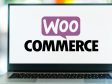 Open laptop displaying the WooCommerce logo