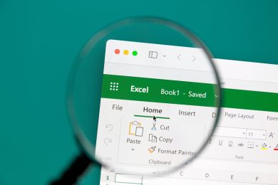 Illustration of a magnifying glass looking at Microsoft Excel