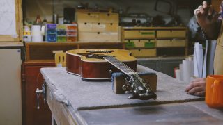 Guitar on a table in a workshop