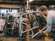 Employee working on a bike frame in a workshop