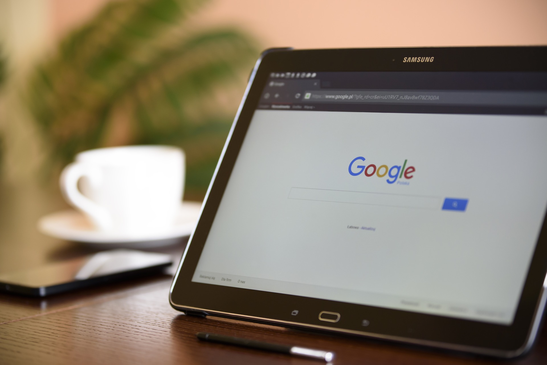 Tablet on a table with Google on screen searching for manufacturing industry challenges solutions. 