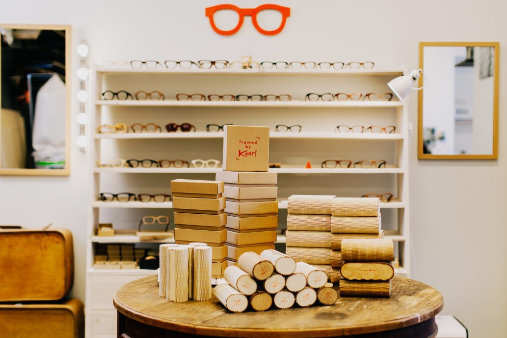Glasses manufacturer front of store display with individual glasses and packages at the end of their production routing. 