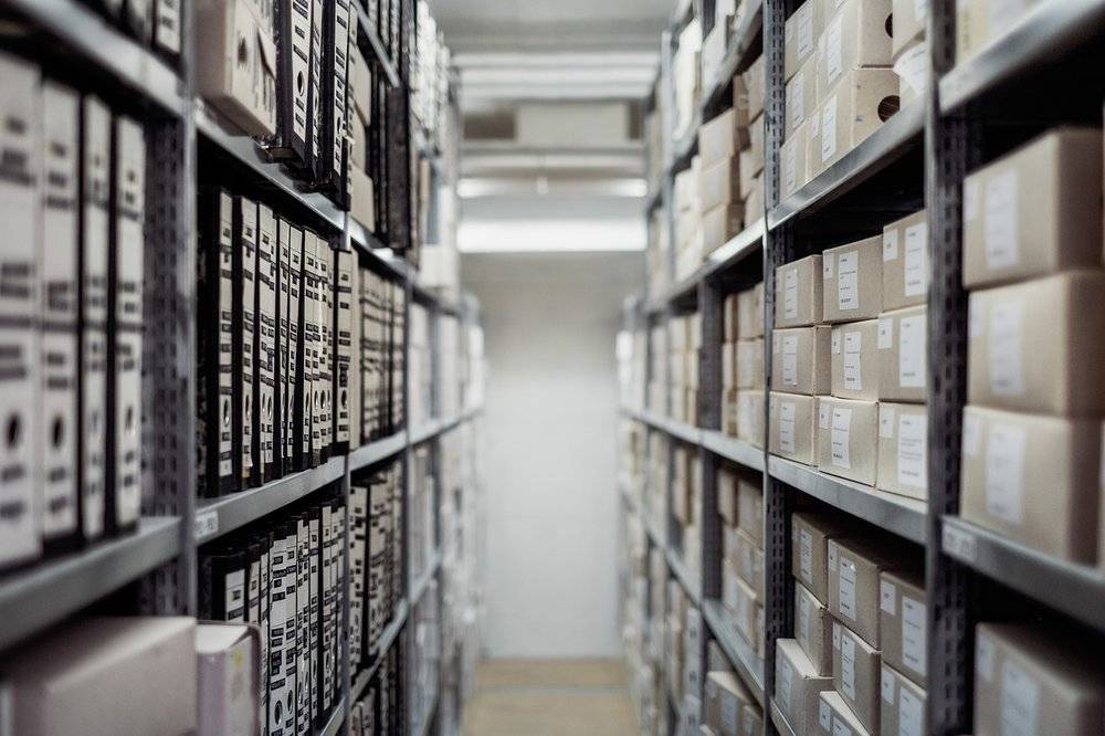 Files and other inventory are stored on two shelves separated by an isle. 