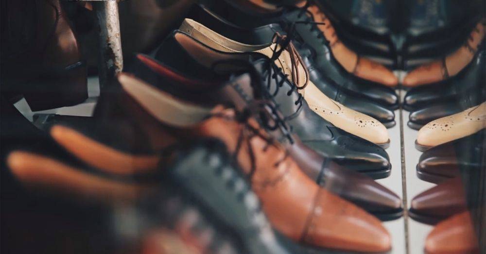 Several pairs of shoes produced from custom leather manufacturing on display to be sold. 
