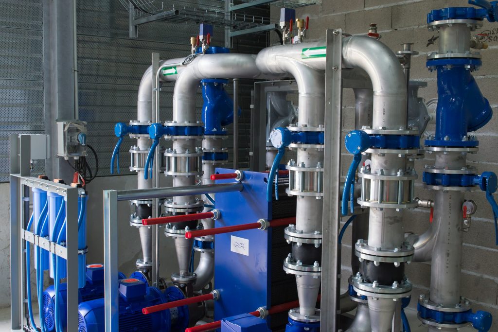 Sterile factory machinery with valves and pipes. 