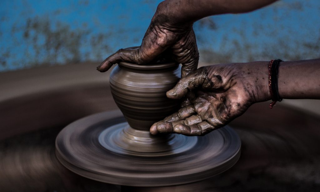 An example of craft production in action, pottery being made by hand. 
