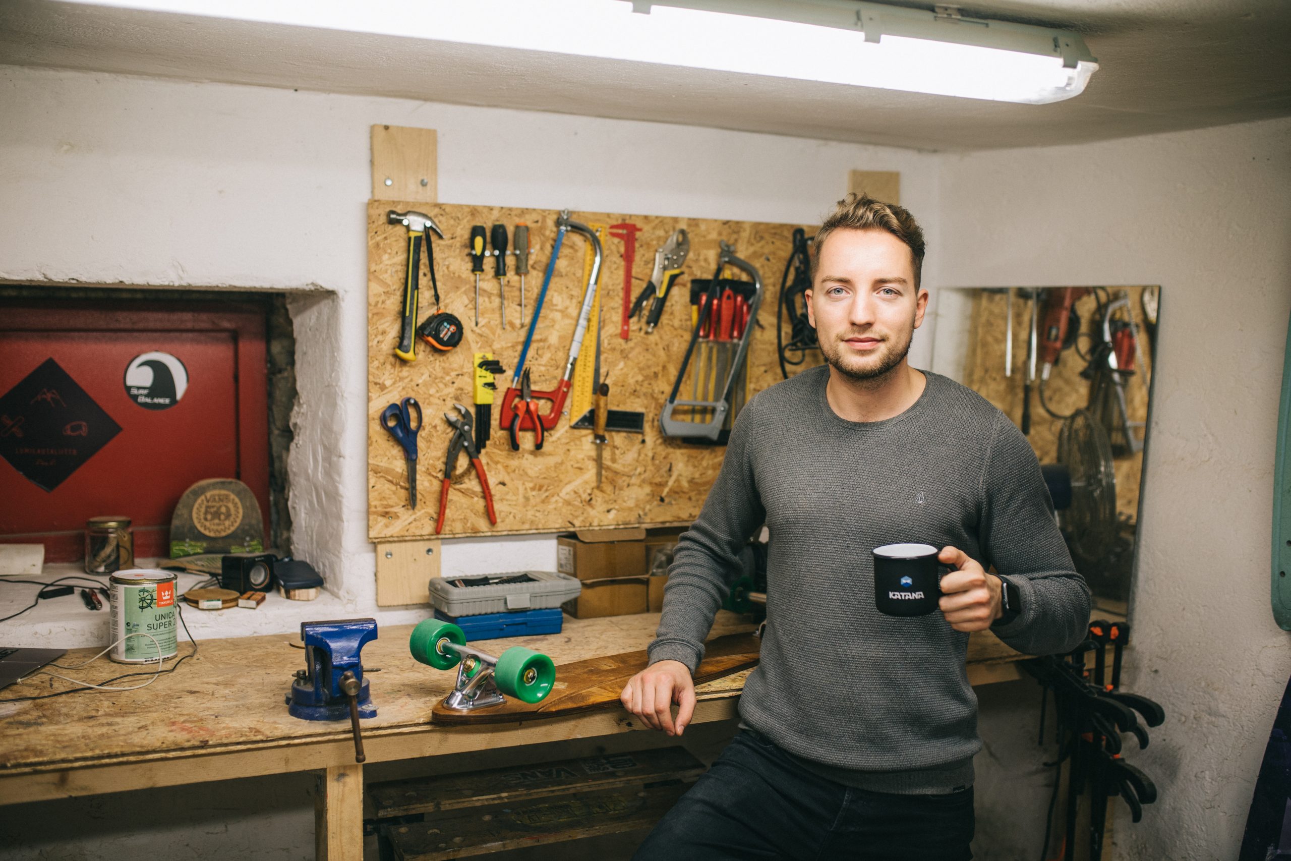 Skateboard manufacturer taking a quick break after the board has been assembled