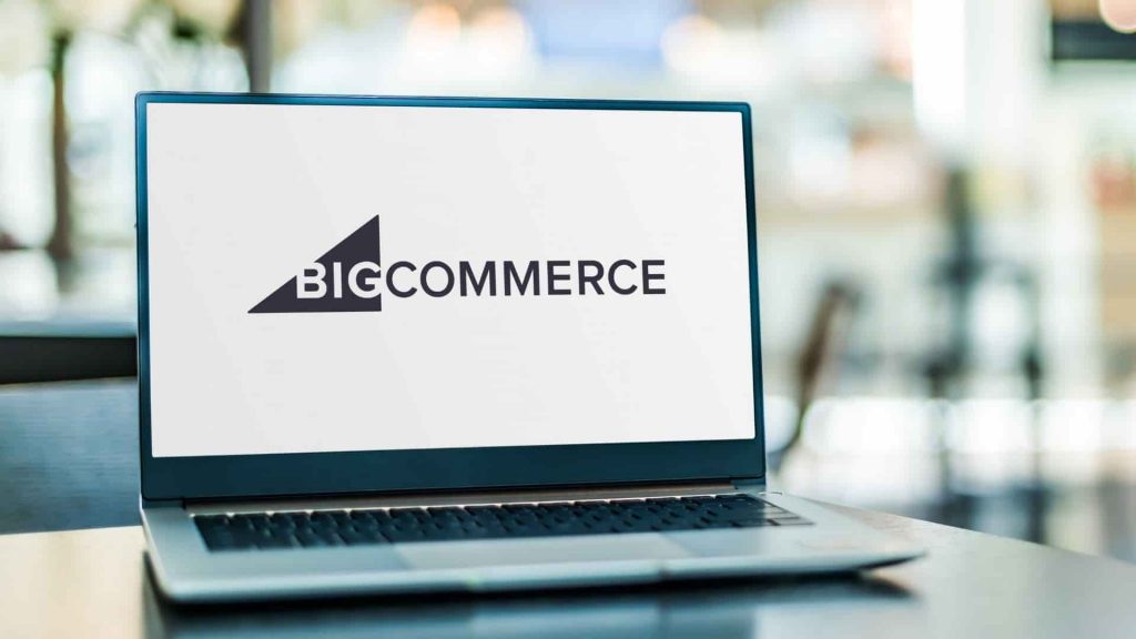 BigCommerce logo showing on a laptop opened on a desk