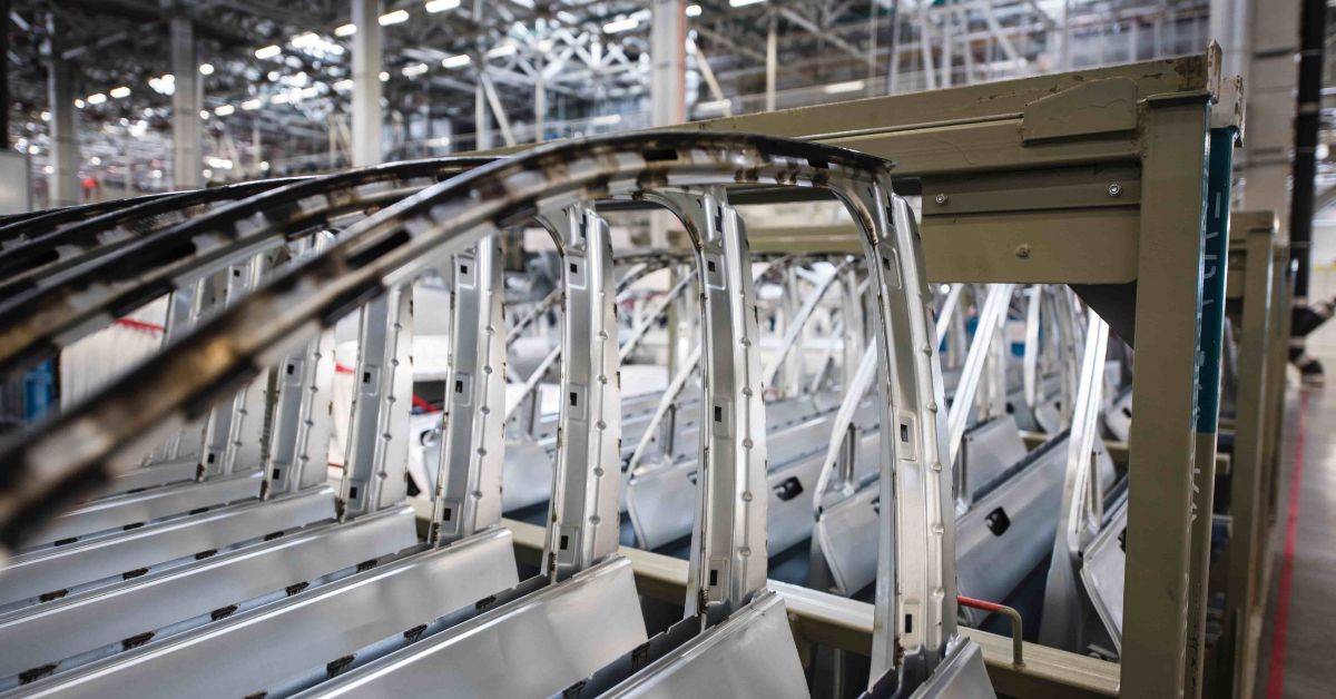 Car door frames stacked in automotive factory