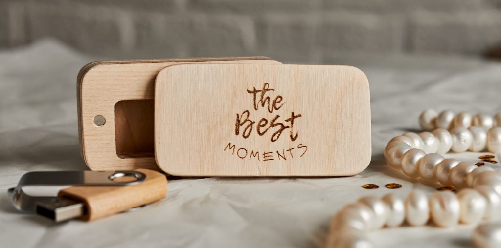 A wooden flash drive in a customized box with engraving