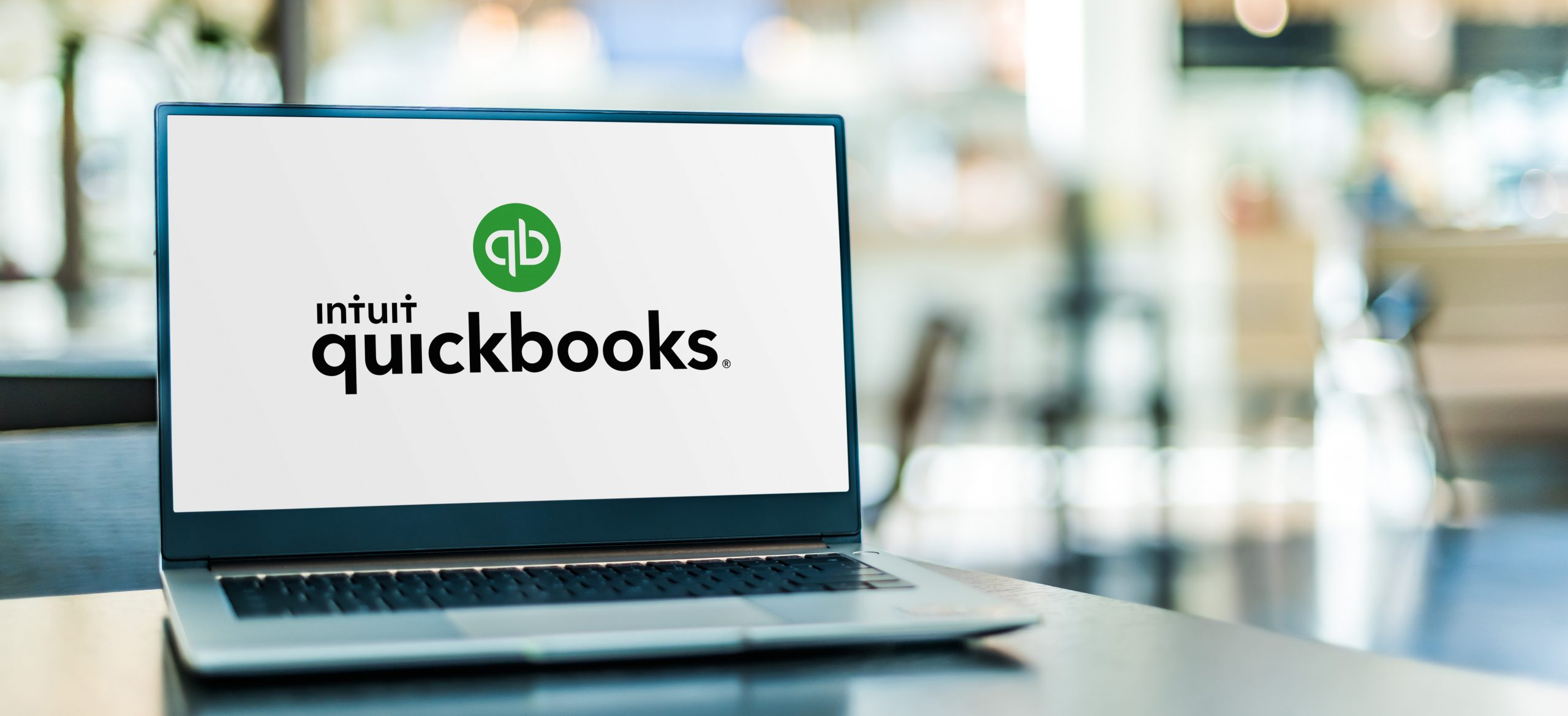 QuickBooks logo displayed on a laptop screen