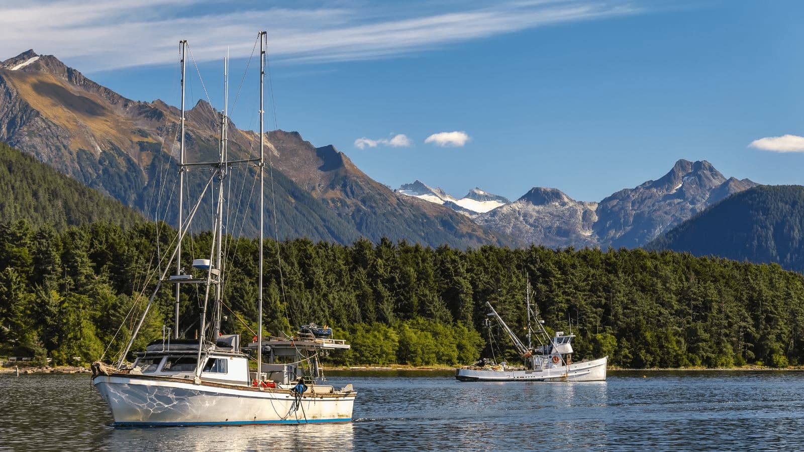 Fishing boats on a lake looking for fish for the food and kindred products industry in Alaska