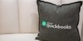 QuickBooks brander pillow on a couch