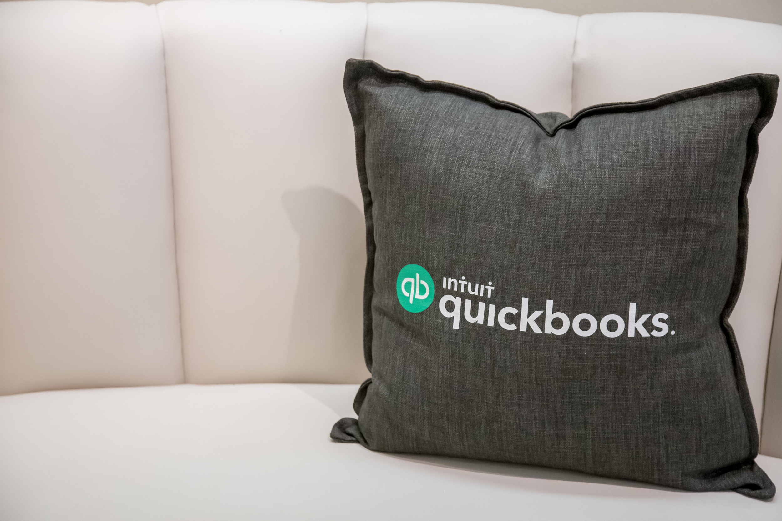 QuickBooks brander pillow on a couch