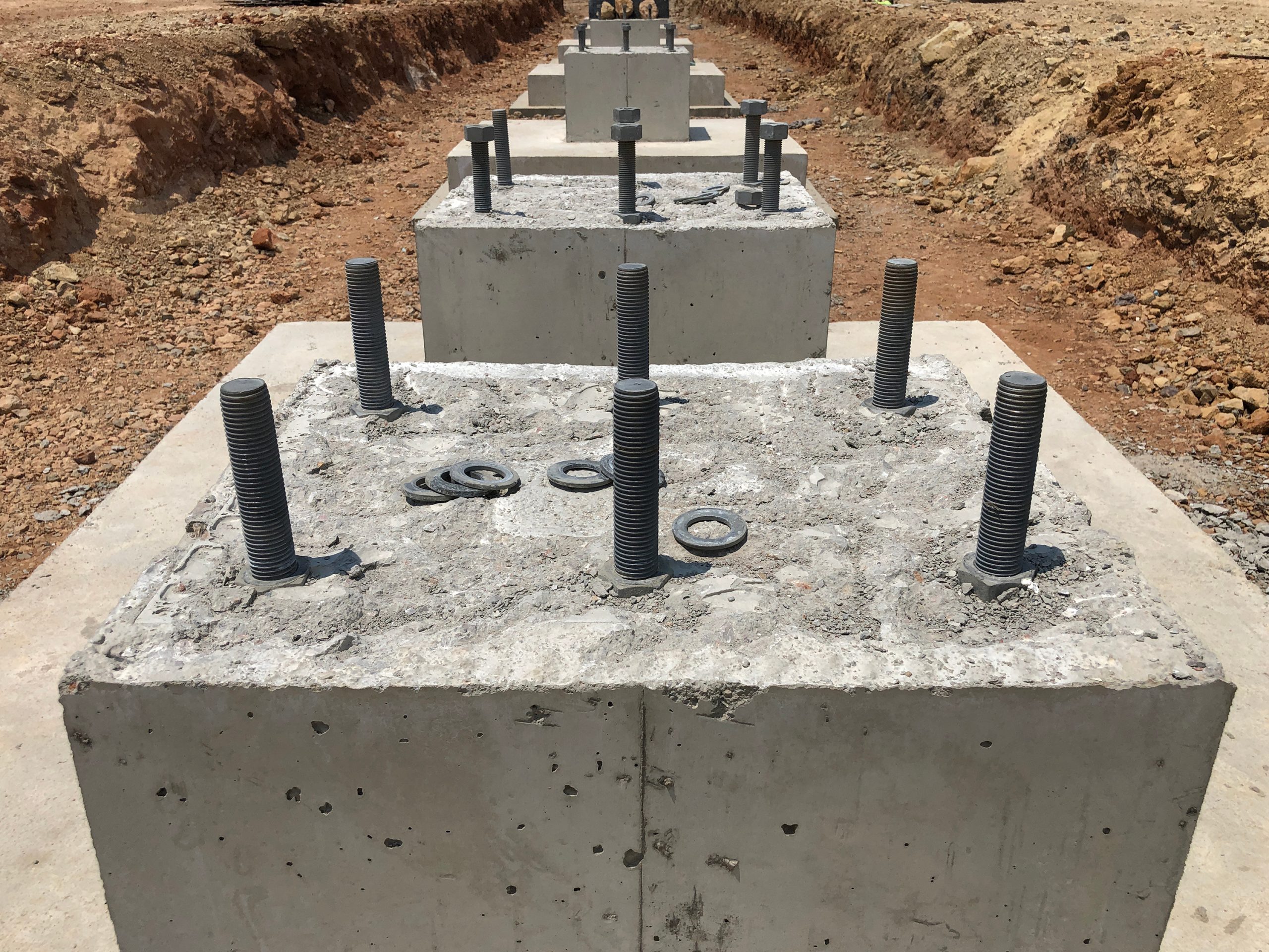 Row of concrete foundations for pillars