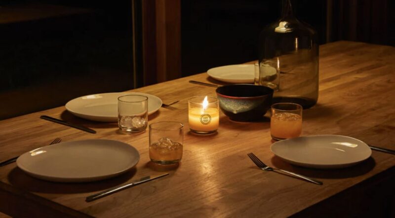 Dining table in a room lit by candle light