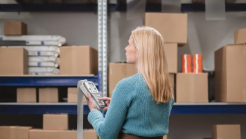 Inventory manager reviewing product costs and tariffs in Katana to track landed costs and margins