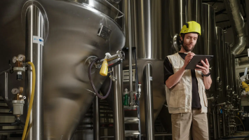 Inventory dashboard in Katana showing stock levels, batch tracking, and movement history on laptop screen